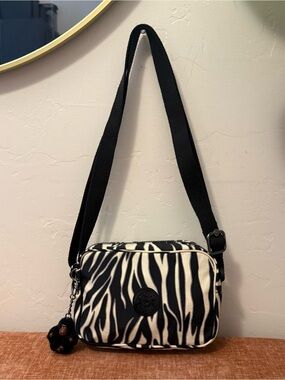 Kipling Zebra print crossbody bag with cute little monkey charm